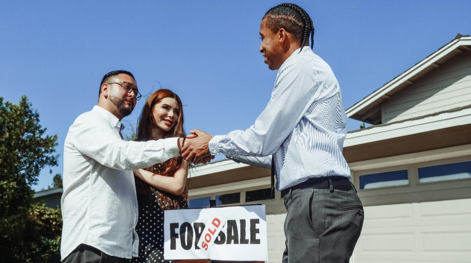 Real estate agent shaking hands with a client